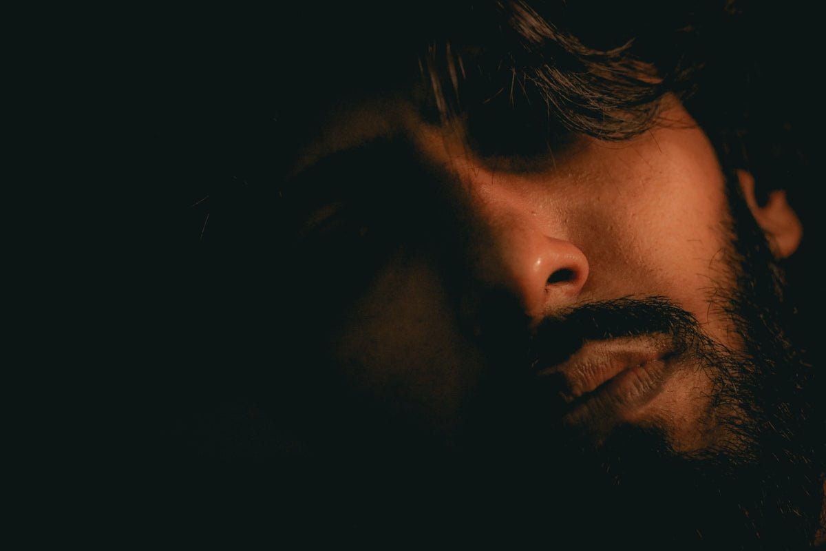 mans face in close up photography