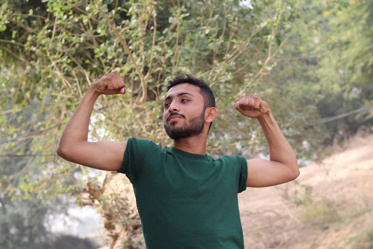 a man with his arms raised