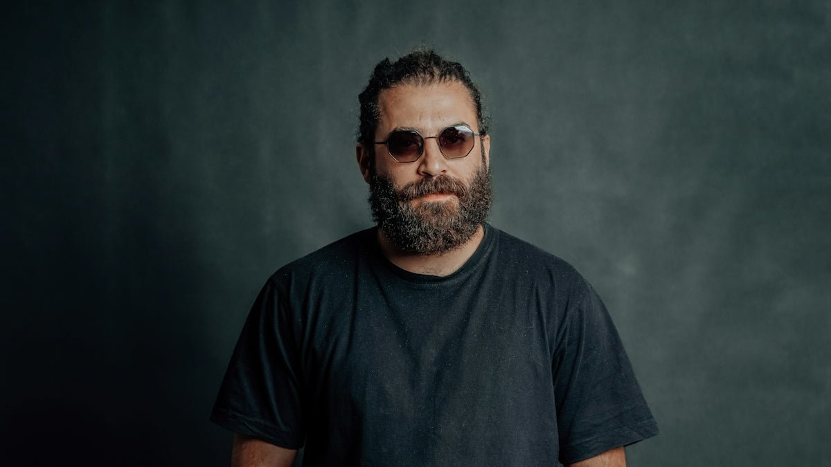 A man with a beard and sunglasses